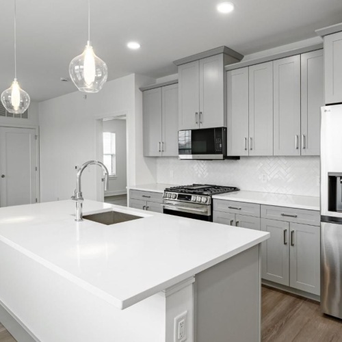 a kitchen with white cabinets