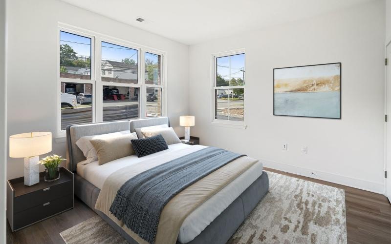 a bedroom with a large window